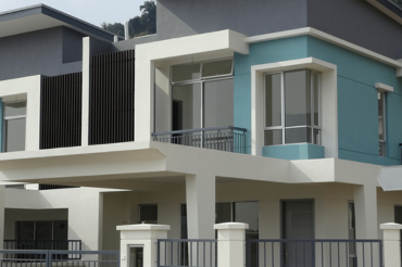 Building exterior coated with Amco weatherproof exterior paint